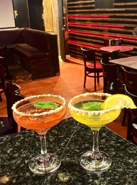 Two colourful cocktails at Cafe Tehran in Glasgow.